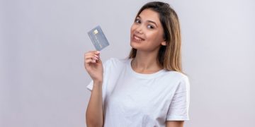 Happy woman with the Tangerine World Mastercard.