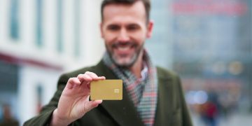 A guy using the American Express Business Gold Rewards.