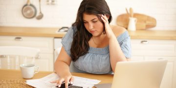 Woman learning what is a bad credit score in Canada.