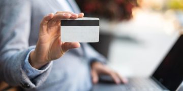 A man holding his Citi Premier Card.