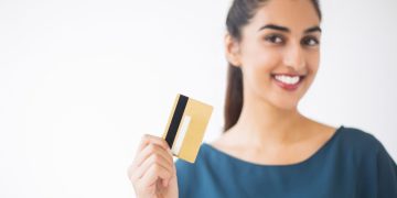 Woman using a Delta SkyMiles Gold American Express.