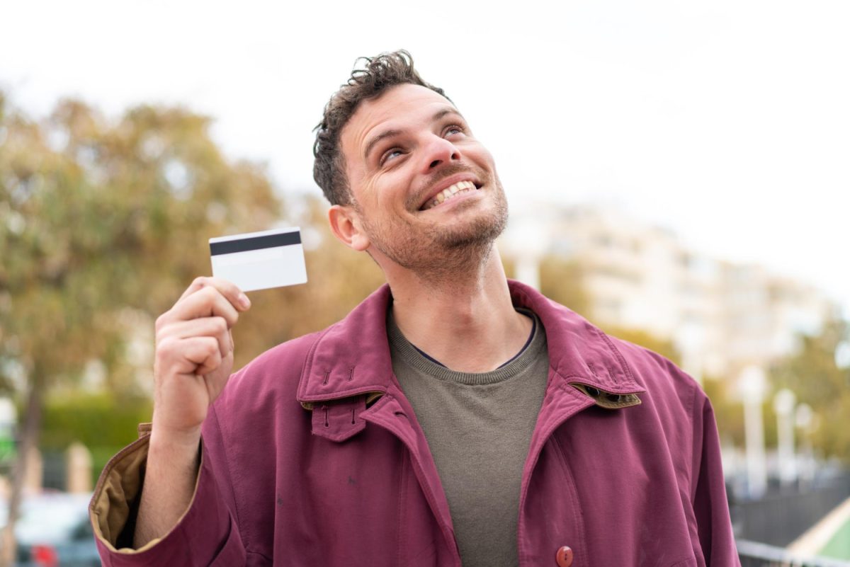 A man being happy about the Rewards Credit Card.