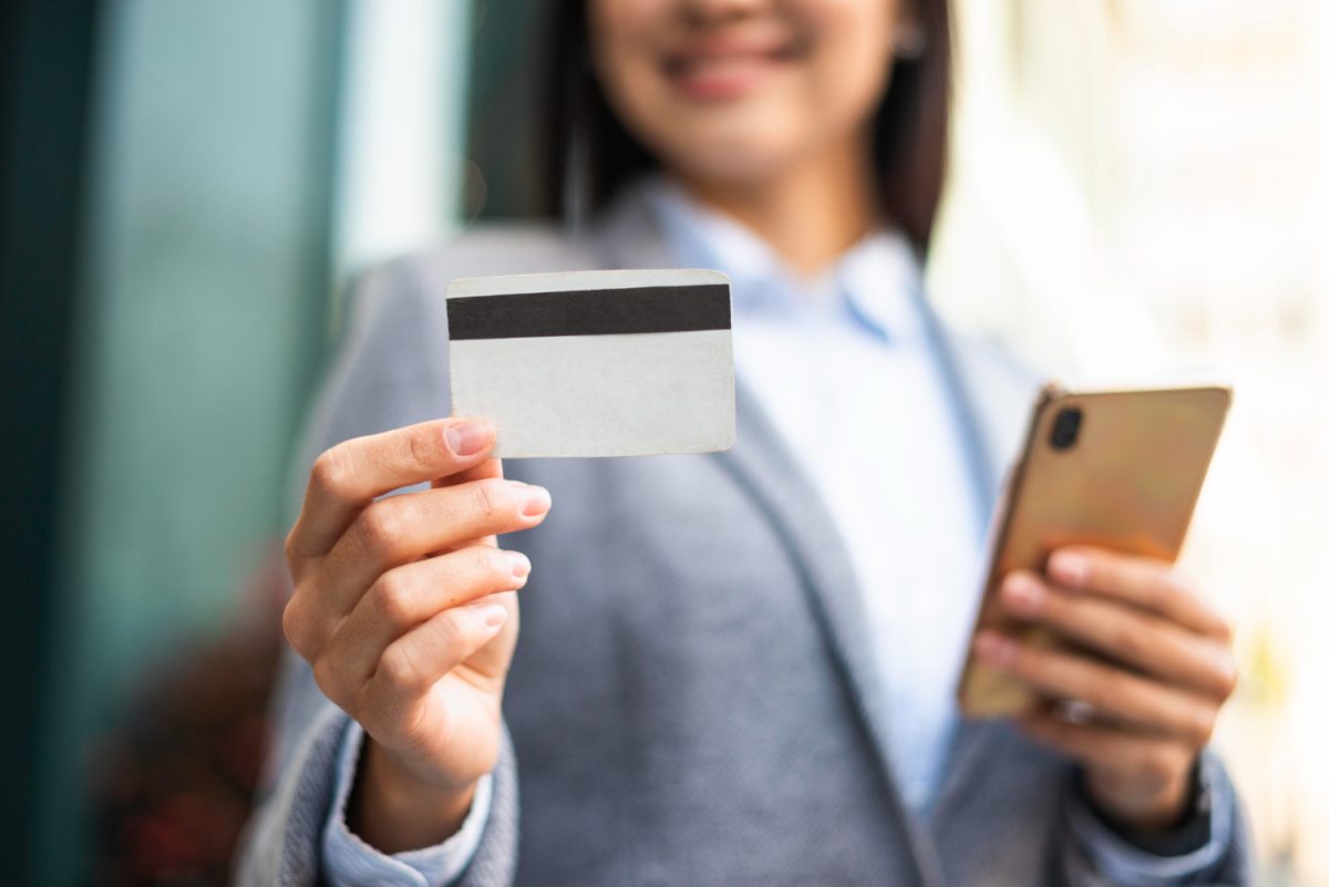 Woman using her Simmons Visa Credit Card.