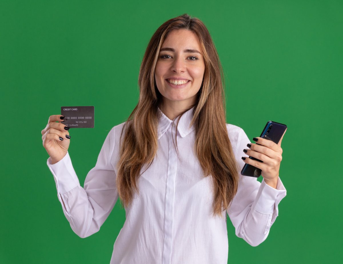 Woman holding her TD Cash Credit Card.