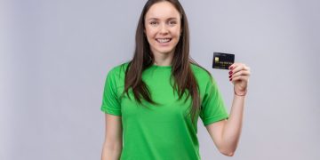 Woman holding her TD Cash Credit Card.