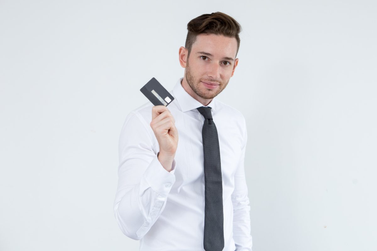 A man holding his Wells Fargo Active Cash