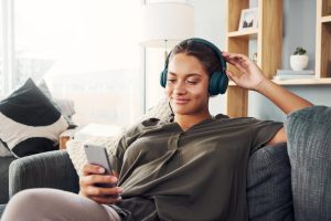 A woman listening to Personal Finance Podcasts.