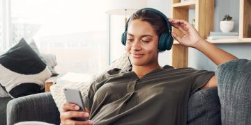 A woman listening to Personal Finance Podcasts.