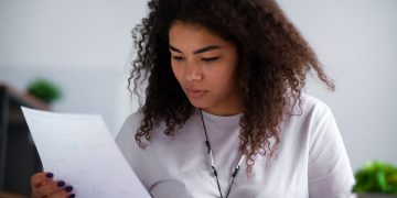 Woman learning about the Credit Monitoring Services.