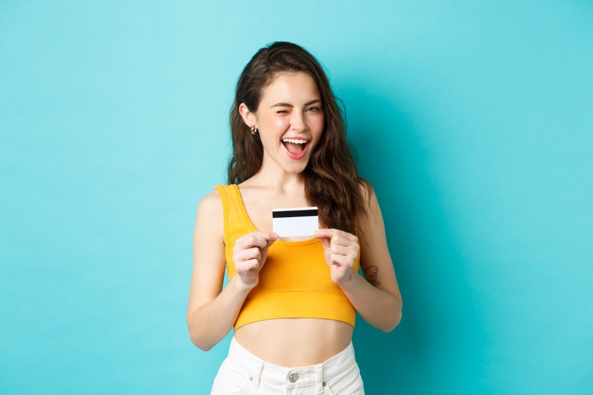 Woman using her cashback credit cards.