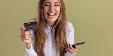 Woman happy with her No Fee Credit Card.