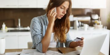 Woman checking her credit card fees.