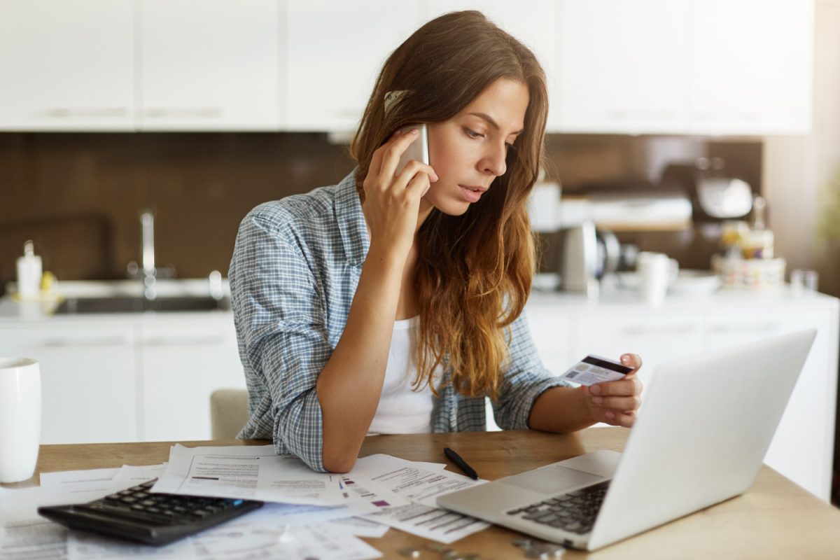 Woman checking her credit card fees.