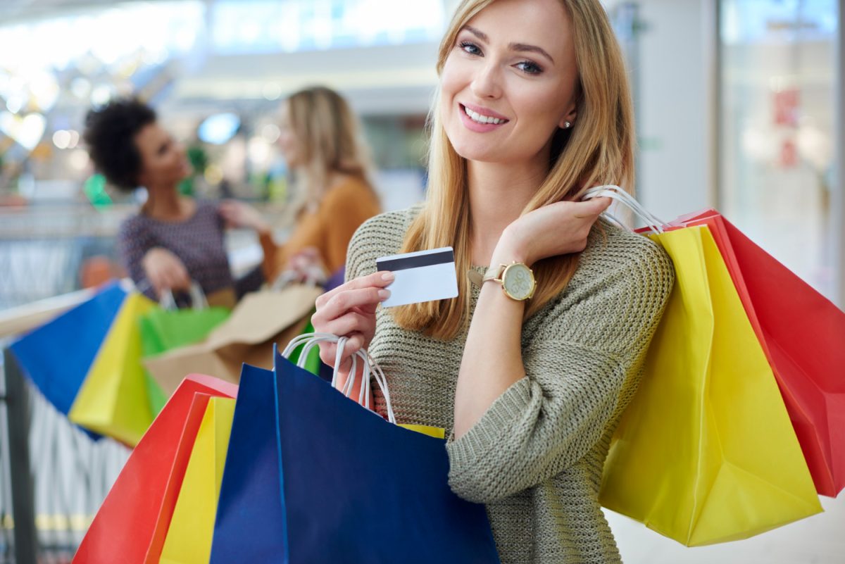 Woman doing shopping after learn how to increase credit card limit.