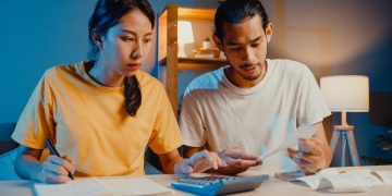 A couple learning How to share a credit card.