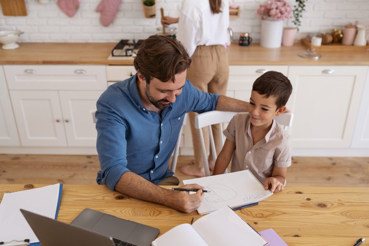 Dad using Savings account for kids with his son.